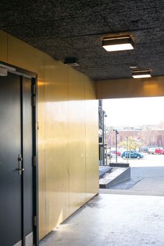 an empty parking garage with two doors open