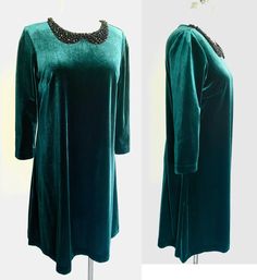 This is a really cute, a-line, stretch velvet dress by Betsey Johnson. It is in mint condition, and all beading is intact. It would be a great dress for holiday parties, and comfortable as well. The fabric is a beautiful deep green stretch velvet, with a faux beaded collar, back zipper, and 3/4 sleeves. Due to the holidays, I will ship out within 24 hours. Bust: 38' Waist:40" Sleeve length: 18" Length- front: 33" Length- Back: 33.5" Welcome to my new Etsy shop! After almost 40 years working as a Dark Green Velvet Dress, Stretch Velvet Dress, Dark Green Velvet, Green Velvet Dress, Wardrobe Stylist, Beaded Collar, Stretch Velvet, Green Velvet, Deep Green