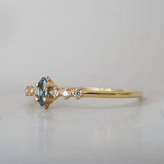 Made for the lover of fine dainty rings. This ring features a precious natural marquise Alexandrite surrounded by natural diamonds. Pair it with any of our ring band to create an elegant look. 14K solid gold 4x2mm natural marquise Alexandrite, approx. 0.1ct Natural diamonds, approx. 0.06ct 1.2mm ring band ** This item is specially made for you. Please allow 1-2 week lead time. Shipping:Domestic: Free standard shipping within the U.S.International: Free standard shipping for orders over $200 Cust Dainty Rings, Fall Rings, Marquise Ring, The Lover, Dainty Ring, Ring Band, Lead Time, Precious Metals, Band Rings