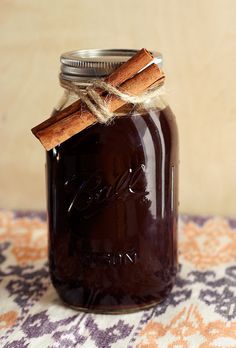 a glass jar with cinnamon sticks in it