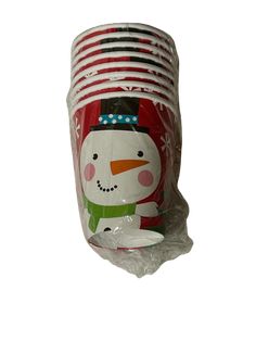 a stack of red and white cups with a snowman on it