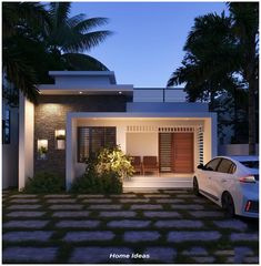 a car is parked in front of a house at night with palm trees around it