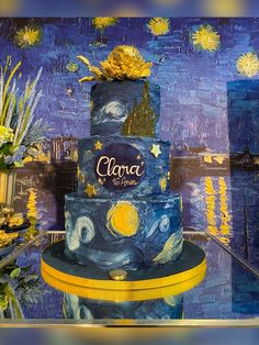 a three tiered cake decorated with the painting starrdust