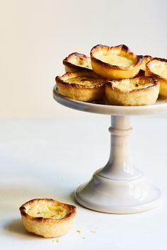 mini pies on a white cake plate