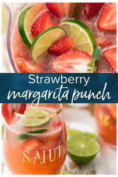 strawberry margarita punch in a pitcher with limes and strawberries