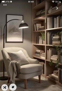 a living room with a chair and bookshelf