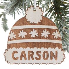 an ornament hanging from a christmas tree with the word caron on it