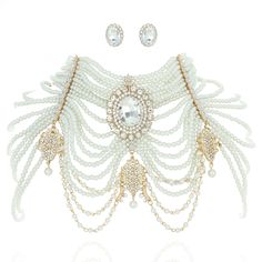 Description Channel your inner Victorian queen energy with this dazzling pearl and rhinestone bib gold necklace set that drapes beautifully across your shoulders. Crafted in an 18-line pearl bib design with a Victorian inspired oval rhinestone center pendant and 3 smaller rhinestone pendants in a draping fashion with double lobster clasp closures. This set comes with matching studded oval rhinestone earrings. Size • Necklace Length: 16 in (40.64 cm) x Drop: 7.5 in (19.05 cm) x Extension: 8 in (2