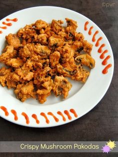 a white plate topped with fried food on top of a table