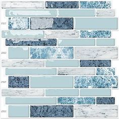 blue and white marble tile wallpaper with different colors on the tiles in this pattern