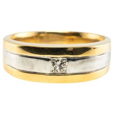 two tone gold and silver wedding bands with a princess cut diamond