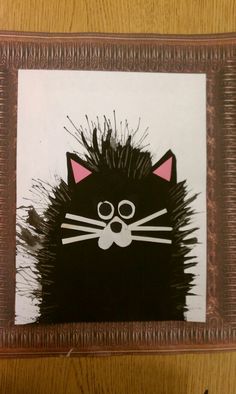 an image of a black cat in a frame