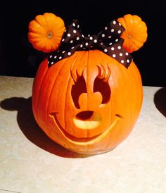 a pumpkin with a minnie mouse head on it