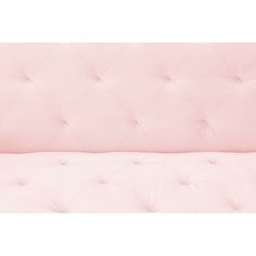 the back of a pink couch with buttons on it