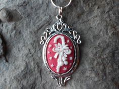 For sale is a beautiful flawless (white christmas candy cane on a red background) cameo pendant necklace!!!! They are offered at a reasonable price, make perfect gifts, and are wonderful quality!!!!  The cameo is set in a pretty tibetan silver setting, about 1 1/2" long, and the chain is 22" .925 silver plated 1.2mm snake chain, with a lobster claw clasp!!!! Very festive for the holiday season!!!!  I make several varieties, colors, styles and matching sets!!!!  I will be glad to do special reque Vintage Christmas Gift Necklaces, Vintage Necklaces For Christmas Gifts, Vintage Necklace For Christmas Gift, White Cameo Necklace For Gift, Red Cameo Necklace For Gift, Red Christmas Necklaces Perfect For Gifting, Red Christmas Necklace Gift, Red Cameo Jewelry Gift, Red Necklace For Christmas Gift