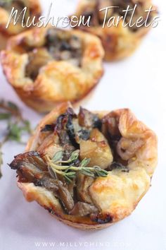 mini mushroom tartlets with herbs on top