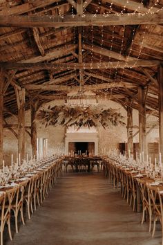 a large room with tables and chairs covered in lights