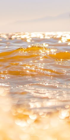 the sun shines brightly on the water as it reflects off the surface of the ocean