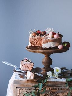 two pieces of cake sitting on top of a table