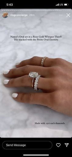 a woman's hand with two rings on it and an email message to her