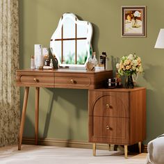 a bedroom scene with focus on the dressing table and mirror, which has been placed in front of a window