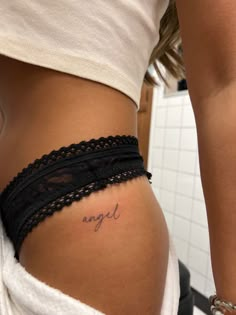 Tattoo Body Locations, Angel Tattoo On Hip, Angle Word Tattoos, Word Angel Tattoo Fonts, Script Tattoo On Hip, Women Tattoos Hip, Name On Hip Tattoo, Small Tattoo Areas For Women, Hip Tattoos Women Writing