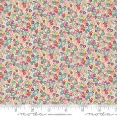 an image of a flowery fabric with small flowers in pastel colors and pinks