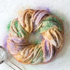 a powdered doughnut sitting on top of a white counter