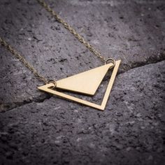 "Triangle necklace - geometric triangle with V-shaped hole pendant. Featuring minimalist  silhouettes. ★ Comes in our signature gift box, ready for gift giving.  ★ Available in Silver [Sterling silver chain & silver plated pendant]  ★ Available in Gold [ gold-filled chain & gold plated brass pendant]  ★ Pendant size: 1.10\"X1.80\" Thanks for shopping at ByYaeli♥  All images, texts & products are property of ByYaeli ©2020" Gold Geometric Minimalist Necklace, Minimalist Gold Geometric Necklace, Minimalist Geometric Gold Jewelry, Minimalist Triangle Gold Jewelry, Minimalist Gold Triangle Jewelry, Minimalist Geometric Gold Necklace, Gold Triangle Necklace For Gift, Minimalist Geometric Necklaces For Everyday, Minimalist Pyramid-shaped Jewelry For Gifts