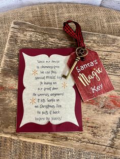 a wooden table topped with a red and white sign next to a keychain