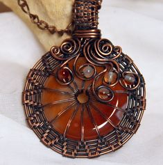 Absolutly unique Cornelian Pendant! I made it by using Wire Wrap technique with copper wire. Then the wire was oxidized and ground. I love this stone very much.  It is believed that carnelian is a heart stone, pleases the heart, and attracts true love. It goes with copper chain. Hand Forged Carnelian Jewelry As Gift, Bohemian Rust-colored Jewelry For Gifts, Hand Forged Carnelian Jewelry For Gift, Bohemian Amber Jewelry Hand Forged, Bohemian Amber Jewelry With Hand Forged Details, Handmade Rust Copper Wire Jewelry, Hand Forged Amber Bohemian Jewelry, Handmade Spiritual Rust-colored Jewelry, Orange Copper Wire Wrapped Jewelry