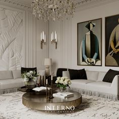 a living room filled with white furniture and chandelier