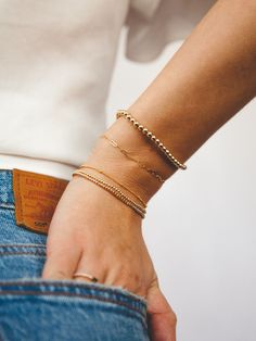 A must-have for every arm party, our Everyday Stretch Bracelets were made for stacking! Mix in this mid-sized style to your stack for a fun new shape and shimmer. Designed with durability in mind, our gold-fill beads are secured on extra-strength stretch cord to withstand your busy life and maintain their shine. Whether you dress them up, dress them down, or pile them on, you’ll truly never take them off. Trendy Gold Stackable Stretch Bracelet, Minimalist Yellow Gold Stretch Bracelet For Everyday, Minimalist Stackable Beaded Bangle Bracelets, Minimalist Stackable Bangle Beaded Bracelets, Trendy Stackable Gold Charm Bracelet, Minimalist Stackable Beaded Bangle Bracelet, Trendy Everyday Stackable Gold Bracelet, Trendy Gold Stretch Bracelet For Everyday, Trendy Gold Stackable Charm Bracelet