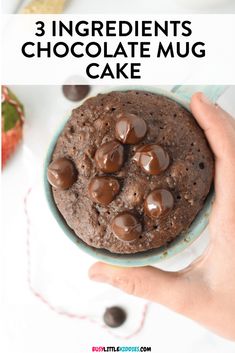 a person holding a chocolate mug cake in their hand with the words 3 ingredients chocolate mug cake