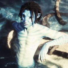 a man with dreadlocks is in the water