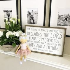 a shelf with flowers and pictures on it