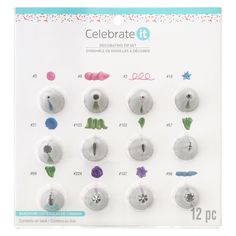 an assortment of buttons with different designs and colors on the front of a white card