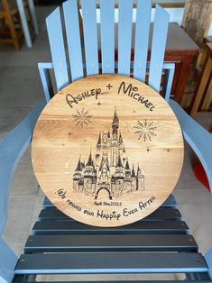 a wooden sign that says disney and mickey's castle is on top of a blue chair