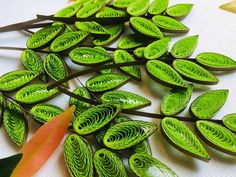 some green leaves are laying on the table