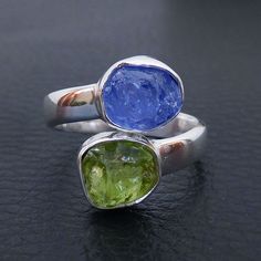 Natural Raw Tanzanite & Peridot Ring, Multi Stone Ring, Adjustable Ring, Handmade Silver gemstone Ring. Product:- Ring Modal no:- U379 Metal:- 925 Sterling Silver Gemstone :- Peridot & Tanzanite Gemstone size:- 8x10 mm approx. Finishing:- Shiny Silver We are using Pure 925 (Stamped) Sterling Silver with Natural Gemstone Jewelry, all of our jewelry designs are Handmade. We are adding new creative designs in our store regularly, for new handmade stuff please get touch with our store. We al Raw Tanzanite, Rough Stone Ring, Black Tourmaline Ring, Tanzanite Jewelry, Handmade Stuff, Nature Ring, Peridot Stone, Natural Gemstone Jewelry, Tanzanite Ring