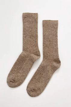 The Snow socks are made with extra length to be worn up the calf or scrunched down for a 90's look. The extra length can be worn up for an added layer of warmth from the wool blend yarn or scrunched or folded with your favorite booties. Ethically made in South Korea 34% Wool | 4% Cotton | 38% Nylon | 22% Polyester | 2% Spandex One size fits most (US women's size 6-10) 90s Looks, Fisherman Sandals, Winter Socks, Wool Socks, Winter Essentials, Cookies And Cream, Winter Shoes, Winter Knits, Wash Bags