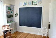 a chalkboard in the corner of a child's room