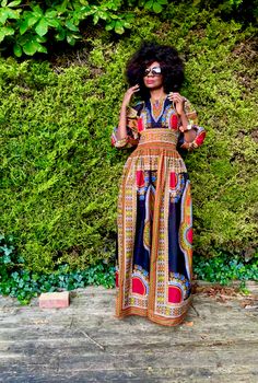 An exquisite black dashiki maxi dress. The smocking at the top gives with the full skirt gives a flattering silhouette. It has full sleeves that can be worn in a puff style or elongated. 100% Cotton Hand made in Ghana. YOU CHECKED YOUR MEASUREMENTS AGANST THE SIZE CHART FOR THIS SHOP? Although we do our best to make sure that the colours displayed on our Website are accurate, the actual colours may vary. Differences in monitors and the device you use to view the website will result in subtle dif Shopify Design, Maxi Skirt Dress, Jumpsuit Trousers, Full Sleeves, Full Skirt, Black Maxi Dress, Skirt Top, Full Sleeve, Ghana