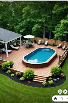 an above ground swimming pool surrounded by landscaping