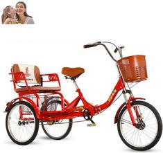 a red tricycle with a basket on the front and side, sitting in front of a white background