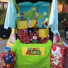 the back end of a car decorated with mario bros decorations