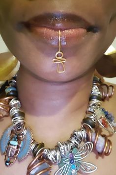 Our Ankh Lip Jewelry is a unique piece. No piercing is required. This item cannot fit into a pierced. This beautiful piece is an original design created by Eye Create LLC ™️ Lip Cuff Jewelry, Unique Ankh Shaped Brass Jewelry, Unique Ankh-shaped Brass Jewelry, Unique Copper Single Earring, Unique Metal Body Jewelry For Gift, Nickel-free Unique Body Jewelry For Festivals, Unique Wire Wrapped Body Jewelry As Gift, Bohemian Ankh Shaped Jewelry For Festivals, Bohemian Ankh Jewelry For Festivals