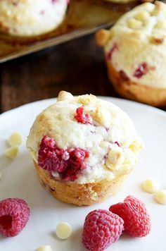 raspberry muffins with white chocolate chips on a plate