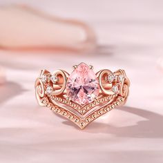 Embrace the beauty and elegance of the morganite bridal set, and embark on a lifetime of love, joy, and shared adventures. Crafted with meticulous attention to detail, this exquisite ring showcases a pear-cut morganite as its centerpiece, radiating a soft, blush hue that symbolizes love and tenderness. The V-shaped design gracefully embraces the morganite, accentuating its natural beauty and creating a captivating silhouette on the finger. The delicate curves of the band perfectly complement the main stone, enhancing its allure and adding a touch of sophistication to the overall composition. Celebrate your love with this extraordinary set that captures the essence of your eternal bond. Let the morganite's gentle glow and the V-shaped design serve as a constant reminder of the love that uni Valentine's Day Pear-shaped Fine Rings, Pear-shaped Morganite Jewelry, Pink Morganite Pear-shaped Jewelry, Exquisite Pear-shaped Gia Certified Rings, Pink Heart-shaped Ring For Valentine's Day, Morganite Bridal Set, Sterling Silver Rings Set, Silver Ring Set, Pear Cut