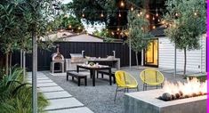 an outdoor kitchen and dining area with yellow chairs